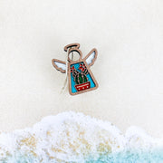 The Forged Flare® Desert Cactus Ornament, a 3.5" Mother's Angels® figurine, showcases angelic cactus and flower designs inspired by Southwest decor—perfect as a unique decorative accent.