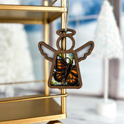 The Forged Flare® Mother's Angels® Monarch Butterfly Ornament with Imperfections is a 3.5" wooden angel figurine featuring stained glass wings—an ideal memorial gift for the holiday season.