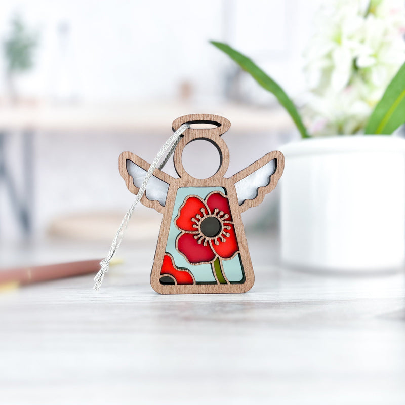 The Forged Flare® Mother's Angels® 3.5" Poppy Ornament features stained-glass wings and a red poppy, perfect for collectors seeking unique angel figurines on Amazon. This is a Warehouse Return item.