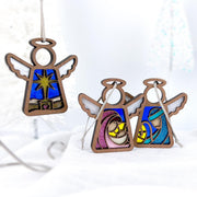 The Forged Flare® Christmas Nativity 3-Piece Bundle features 3.5" stained glass-style angel figurines: one star ornament and two showing the Holy Family—Mary, Joseph, and Baby Jesus—in vibrant colors from Mother's Angels®.