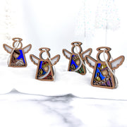 The Forged Flare® Christmas Nativity 4-Piece Bundle features three Wise Men and a shepherd, plus a 3.5" Angel figurine from Mother's Angels®—a beautiful addition to your holiday Nativity scene.