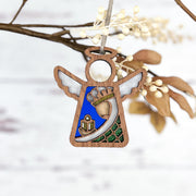 Forged Flare® Christmas Nativity Green Wise Man 3.5" H Angel Figurine from Mother's Angels® features stained glass-style wings, a cornucopia, and green patterns—perfect as a Nativity ornament or holiday gift.