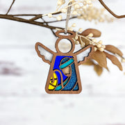 The Christmas Nativity Joseph 3.5" Angel Figurine by Forged Flare® features blue, yellow, and glittery details with white wings and a simple halo—ideal as a Nativity gift or festive decoration from the Mother's Angels® collection.