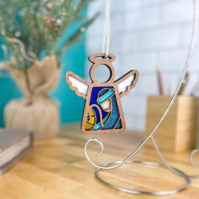 The Forged Flare® Christmas Nativity Joseph 3.5" Angel Figurine from Mother's Angels® features white wings and a stained glass-style blue and yellow design—ideal as a unique Nativity gift for your holiday décor.