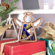 The Forged Flare® Christmas Nativity Purple Wise Man 3.5" Angel Figurine from the Mother's Angels® collection features painted details—a crown, jar, and chain—displayed among gifts and pine for festive holiday decor.