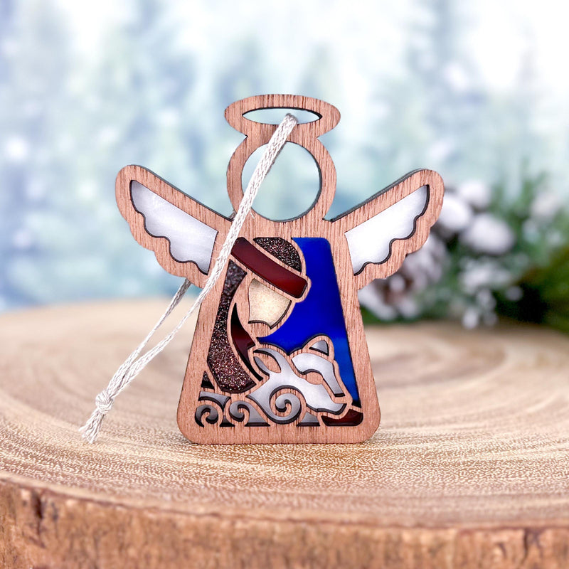 The Forged Flare® Mother's Angels® 3.5" Christmas Nativity Shepherd With Sheep figurine features an angel, perfect as a Christmas nativity ornament or thoughtful gift for the season.