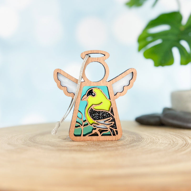 The Forged Flare® Goldfinch Ornament is a 3.5" wooden angel figurine from Mother's Angels®, featuring a painted yellow and black bird—a unique gift for bird lovers, complete with hanging string and natural accents.