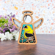 The Forged Flare® Mother's Angels® Goldfinch Ornament is a 3.5" wooden angel figurine with stained glass-style wings and a goldfinch design—an ideal bird lover's gift.