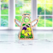 The Forged Flare® Pansy Ornament | 3.5" (H) Angel Figurine from Mother's Angels® features a small wooden angel with yellow and purple pansies—ideal for your Christmas tree or angel figurine collection.