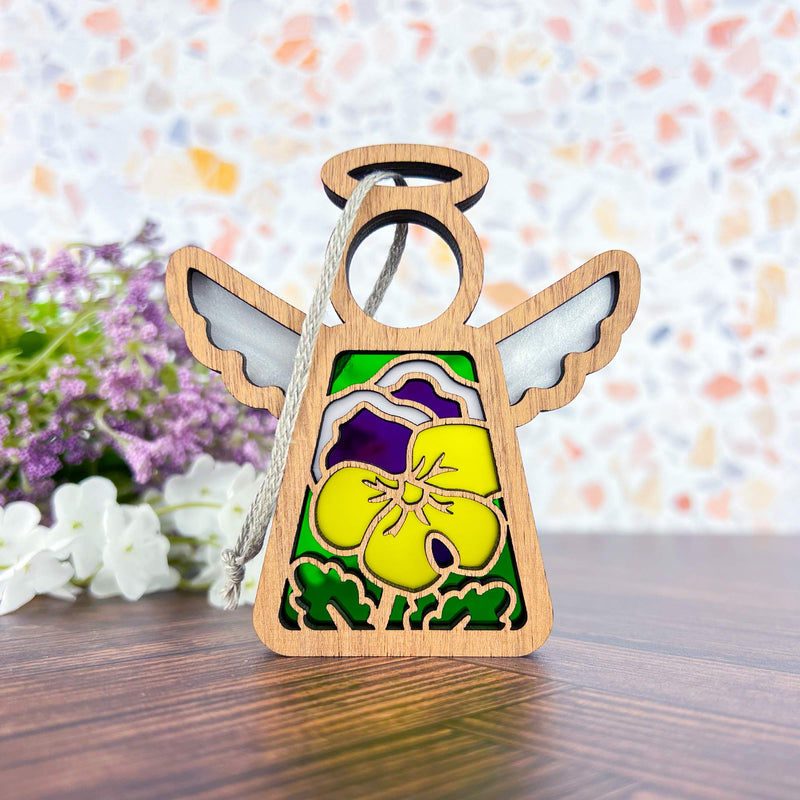 Add charm to your tree with the Forged Flare® Pansy Ornament—a 3.5" Mother's Angels® figurine featuring silver wings, a yellow and purple pansy design, and a hanging loop. Perfect for angel collections or as a unique holiday accent.