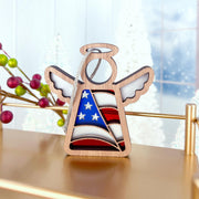 The Forged Flare® Mother's Angels® American Flag Ornament is a 3.5" wooden angel figurine featuring a patriotic flag design—perfect for festive displays or as a thoughtful gift.