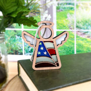 The Forged Flare® American Flag Ornament | 3.5" (H) Mother's Angels® figurine features stained glass-style wings and an American flag pattern—making it a perfect patriotic gift for Christmas or special occasions.