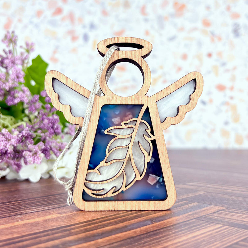 The Feather Ornament | 3.5"(H) Angel Figurine by Forged Flare® features a semi-transparent blue and white feather design with a silver string—ideal as a mindfulness gift or Christmas ornament from the Mother's Angels® collection.