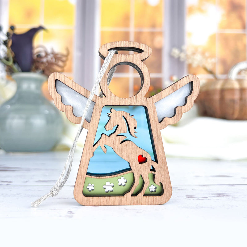 The Forged Flare® Horse Ornament, a 3.5" Mother's Angels® angel figurine with a unicorn cut-out, red heart, and flowers, makes a thoughtful horse memorial gift. It features white wings and a hanging string.