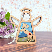 The Forged Flare® Horse Ornament | 3.5" (H) Angel Figurine from Mother's Angels® features a horse cutout, red heart, clouds, and blue sky—ideal as horse decor or a memorial gift. Includes white hanging string; shown near purple flowers.