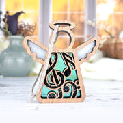 The Forged Flare® Music Ornament—a 3.5" Mother's Angels® figurine—features translucent blue, white, and black musical note accents, making it a charming music teacher gift or addition to any music-themed collection.