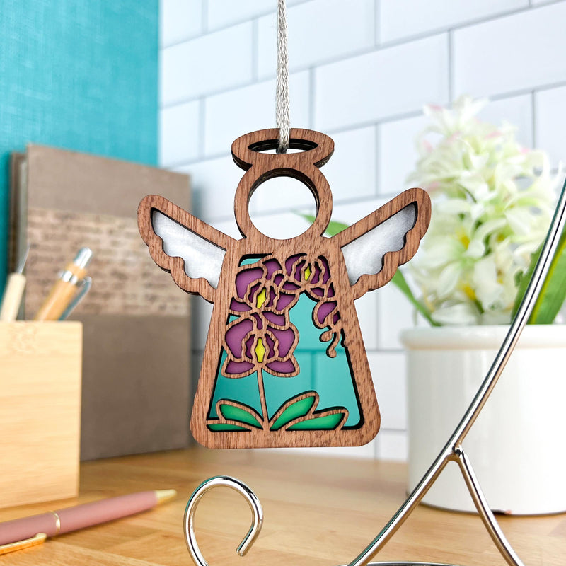 The Purple Orchid Ornament (3.5" H) Angel Figurine by Forged Flare® from Mother's Angels® features white wings and a stained-glass-style body with purple and yellow flowers—ideal for any angel figurines collection.