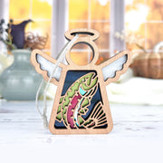 The Rainbow Trout Fish Ornament by Forged Flare® is a 3.5" wooden Mother's Angels® figurine with white wings and a trout cutout, complete with hanging string for use as a Christmas tree ornament.