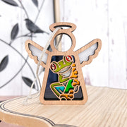 The Forged Flare® Red-Eyed Tree Frog Ornament is a 3.5" Mother's Angels® angel figurine with white wings and a halo, featuring a colorful frog—perfect as a unique Christmas tree ornament or charming frog-themed gift.