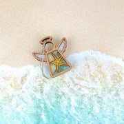 The Forged Flare® Starfish Ornament is a 3.5" Mother's Angels® figurine featuring stained-glass wings and a starfish design—ideal for adding unique beach house decor to your space.
