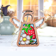 The Forged Flare® Mother's Angels® Strawberry Ornament is a 3.5" angel figurine with white wings and a stained-glass-style red strawberry and flower—perfect as a unique ornament or to accent angel collections on your Christmas tree.