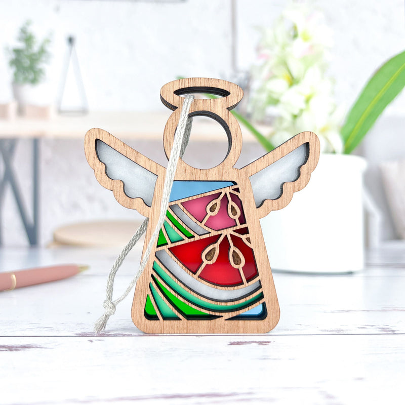 The Summer Watermelon Ornament by Forged Flare® is a handcrafted 3.5" angel figurine from the Mother's Angels® collection, perfect as a unique Christmas tree ornament or decor piece.