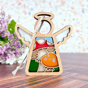 The Forged Flare® Toadstool Mushroom Ornament is a 3.5" wooden Mother's Angels® figurine with stained glass-style inlays, featuring a red and orange mushroom design—perfect as a unique Christmas tree ornament.