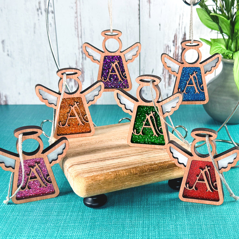 Vibrant handcrafted initial A ornament set in glittery purple, green, orange, blue, pink and red, designed as monogram A ornaments for personalized Christmas ornaments.