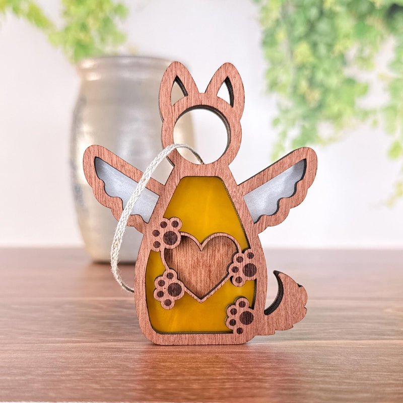The Forged Flare® Forever By My Side Dog Angel Ornament features a winged dog with heart and flower details, yellow and white accents—making it a heartfelt dog lover gift or personalized keepsake.