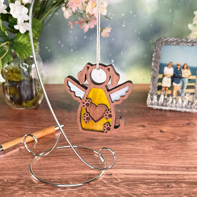 The Forged Flare® Forever In My Heart Dog Angel Ornament features angel wings and paws, hanging from a stand—perfect as a heartfelt dog memorial or dog lover gift.