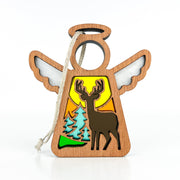 The Autumn Deer Ornament | 3.5" (H) Angel Figurine by Forged Flare® features a winged angel with a cutout deer, trees, and sun scene—hangs by a white string. A thoughtful gift from the Mother's Angels® collection for deer hunters.