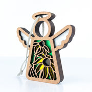 The Forged Flare® Black-Eyed Susan Ornament is a 3.5" Mother's Angels® wooden angel figurine with wing and halo, cutout yellow Black-eyed Susans on green, and a gray hanging string—perfect as a Christmas ornament.