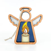 The Burning Candle Ornament by Forged Flare® is a 3.5" wooden Mother's Angels® figurine with white wings, blue body, and a yellow candle design. Includes white hanging string. Perfect as a Christmas or angel ornament. Photographed on a plain white background.