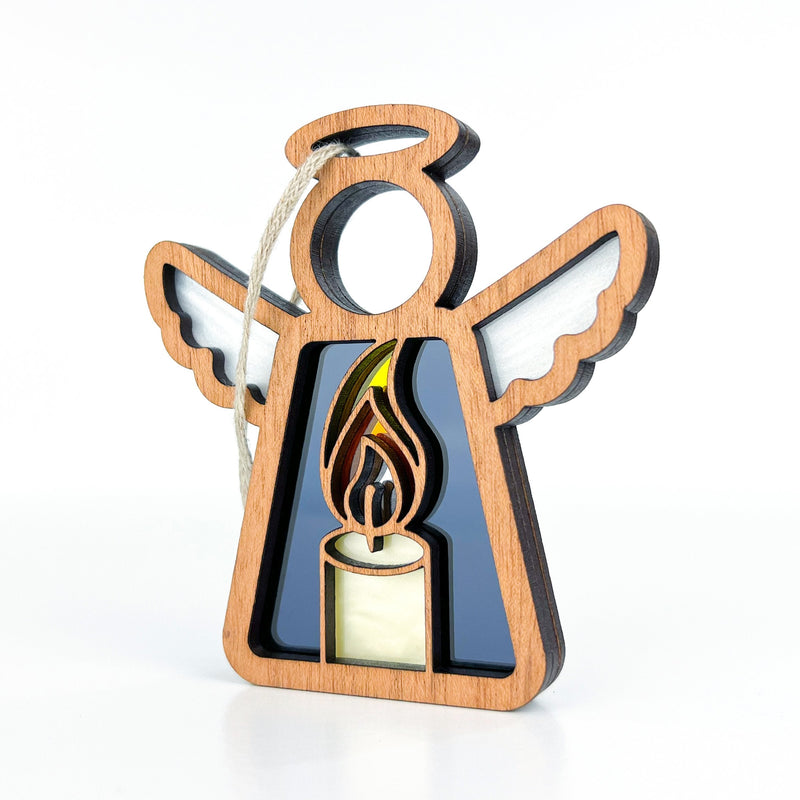 This memorial gift for Christmas features a glowing candle within a Christmas angel ornament, ideal for tree decoration.