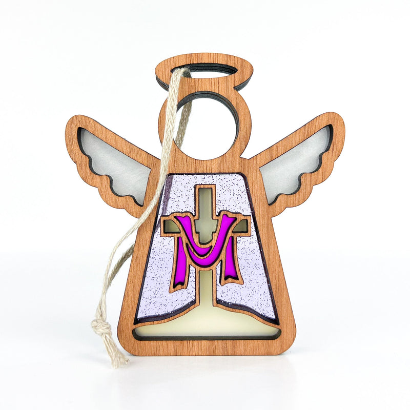 The Forged Flare® Limited Edition By Grace Ornament is a 3.5" Mother's Angels® wooden angel figurine with outstretched wings, a cross, pink “M,” halo cutout, and string for hanging—perfect as an elegant Easter decoration.