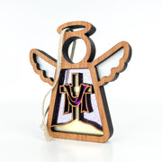 The Limited Edition By Grace Ornament from Forged Flare® is a 3.5" Mother's Angels® figurine featuring a wooden angel with white wings, halo, and purple/gold cross draped in purple cloth, plus a looped string for easy hanging.