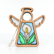 The Forged Flare® Mother's Angels® Calla Lily Ornament is a 3.5" wooden angel figurine with a cutout halo, white wings, stained-glass-style calla lily, green leaves, yellow center, and comes with a string for hanging.