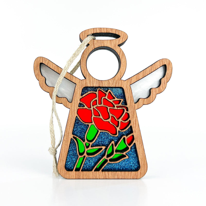 Forged Flare® Mother's Angels® Carnation Ornament: a 3.5" wooden angel figurine with stained glass effect, red carnations, halo, cutout wings, and hanging string—ideal as a birth flower gift. Set against a plain white background.