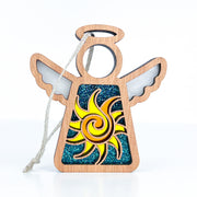 The Celestial Sun Ornament by Forged Flare® is a 3.5" wooden Mother's Angels® figurine with a yellow-orange swirl sun design, blue glitter background, transparent wings, and hanging string—making it a charming beach-themed Christmas gift.