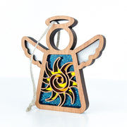 The Celestial Sun Ornament by Forged Flare® is a 3.5" Mother's Angels® figurine featuring cut-out wings and a sun design over a blue glittery background—perfect as a unique Christmas ornament or beach-themed gift.