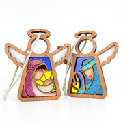 The Forged Flare® Christmas Nativity 2-Piece Bundle features two 3.5" wooden angel ornaments—Mary with baby Jesus and Joseph—both with stained glass-style designs and hanging cords. Part of the Mother's Angels® collection.