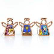 The Forged Flare® Christmas Nativity 3-Piece Bundle includes 3.5" Mother's Angels® figurines: a star, Mary and Joseph, each with colorful stained glass-style painted designs.