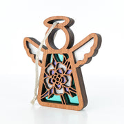 The Forged Flare® Columbine Ornament is a 3.5" wooden Mother's Angels® angel figurine with a cut-out columbine flower, purple and teal hues, white-accented wings, dark edges, and a hanging string for display.