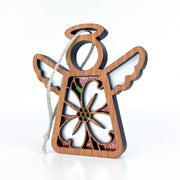 Introducing the Dogwood Ornament from Forged Flare®, a 3.5" angel figurine from the Mother's Angels® collection. This wooden ornament features white wings, a halo, and a large flower cutout in the center. It is adorned with glittery accents and has a looped string at the top for easy hanging, set against a plain white background. Perfect for adding charm to your Christmas tree!