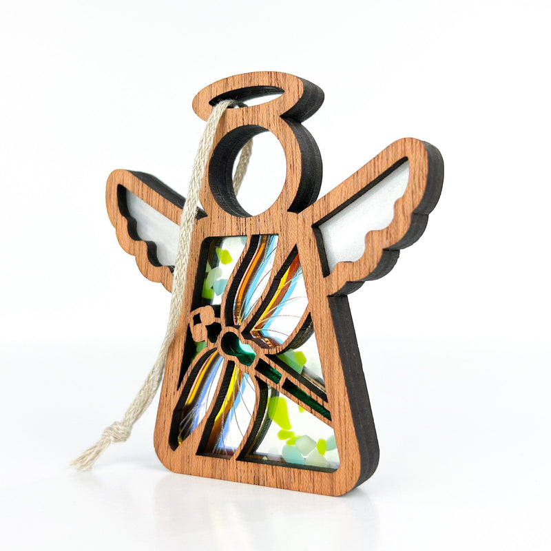 The Forged Flare® Mother's Angels® 3.5" wooden angel ornament features white wings, a hollow center with a colorful glass dragonfly panel, and a white hanging string. Warehouse return—ideal for collectors or Amazon bargain hunters.