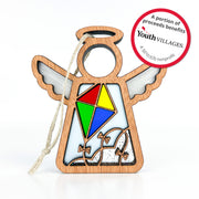 The Forged Flare® Fly A Kite for Charity Ornament is a 3.5" Mother's Angels® wooden angel with a colorful kite, hanging string, and circular tag noting that proceeds support Youth Villages, a 501(c)(3) nonprofit. Great for Christmas or beach house decor.