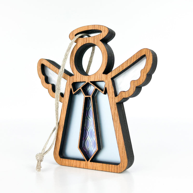 The Forged Flare® Forever Your Father Ornament (3.5" H, Mother's Angels®) features a wooden angel with white wings, a halo, patterned tie, and hanging string—perfect for Father's Day or Christmas décor on any tree.