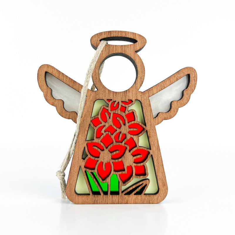 The Gladiolus Ornament by Forged Flare® is a 3.5" wooden Mother's Angels® figurine with a halo, open wings, and rope for hanging. Its body has a stained-glass style gladiolus flower—the August birth flower—with green leaves.