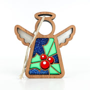 The Forged Flare® Holly Ornament is a 3.5" Mother's Angels® figurine with cutout wings, halo, twine loop, blue glitter body, and green holly with red berries—perfect for December's birth flower theme.