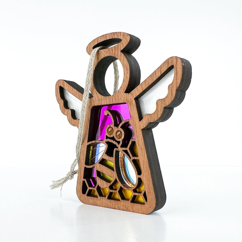 A 3.5" wooden angel figurine from Forged Flare® Mother's Angels® Collection, featuring white wings and a bee-and-honeycomb design with colorful stained glass accents, available as a warehouse return on Amazon.